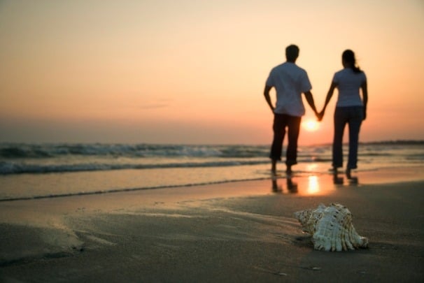 Couple holding hands...walking along the beach!