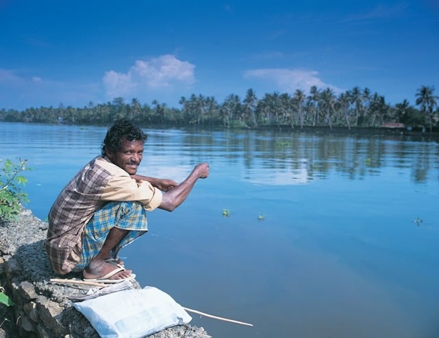 Fisherman at Riverside 