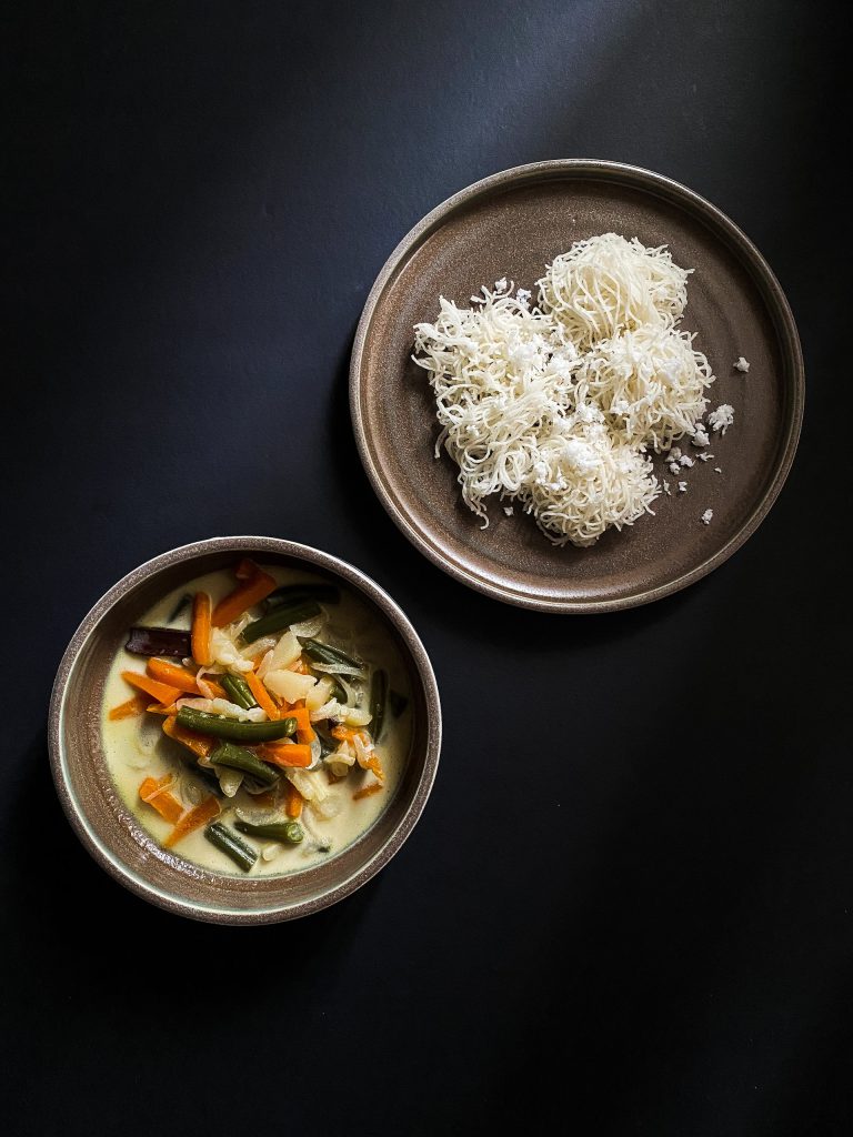 Authentic Kerala cuisine experience included in Kerala tour packages