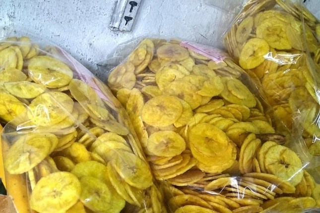 Kerala-style crispy banana chips fried in coconut oil, a must-buy snack for Kerala tour packages travelers.