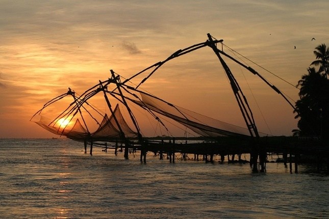 Chinese fishing nets sunset view in Kerala tour packages