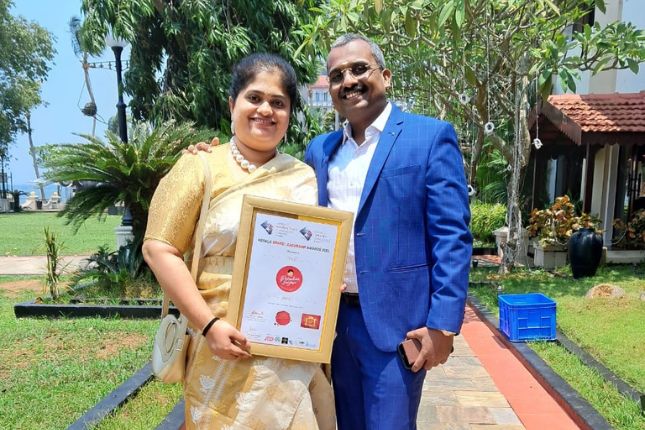 Paradise Holidays showcasing Kerala Brand Leadership Award for excellence in Kerala tour packages